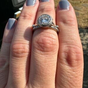 Elegant white gold moissanite wedding ring set with diamond band